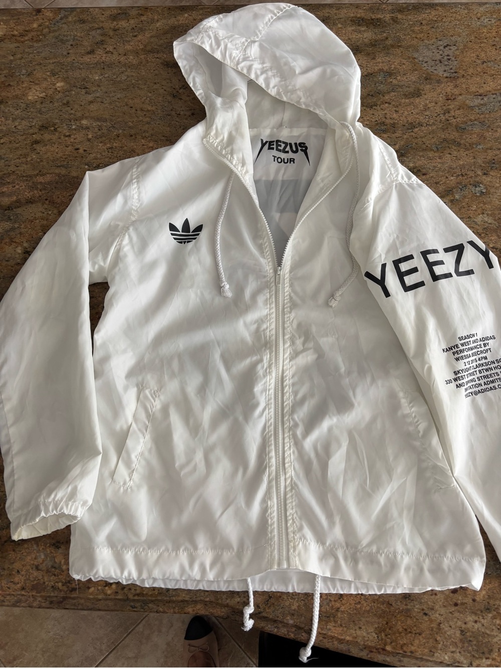 Yeezy White Jacket with Black Logo and Sleeve Text